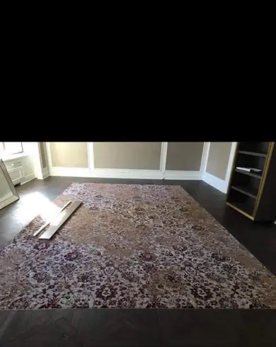 Finished dark wood flooring in a completed room