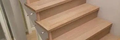 Finished wood stairs and flooring work by Azure Flooring